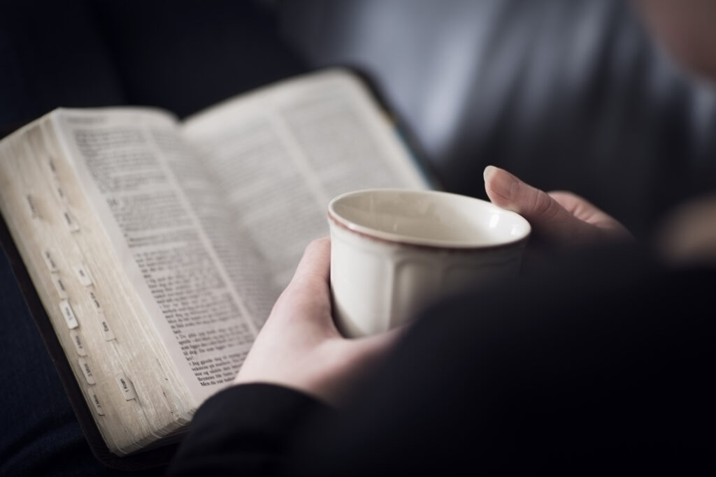 A close-up of a christian woman reading and study in the bible.