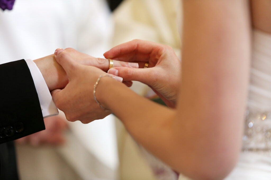 Bride and groom during wedding rings exchange